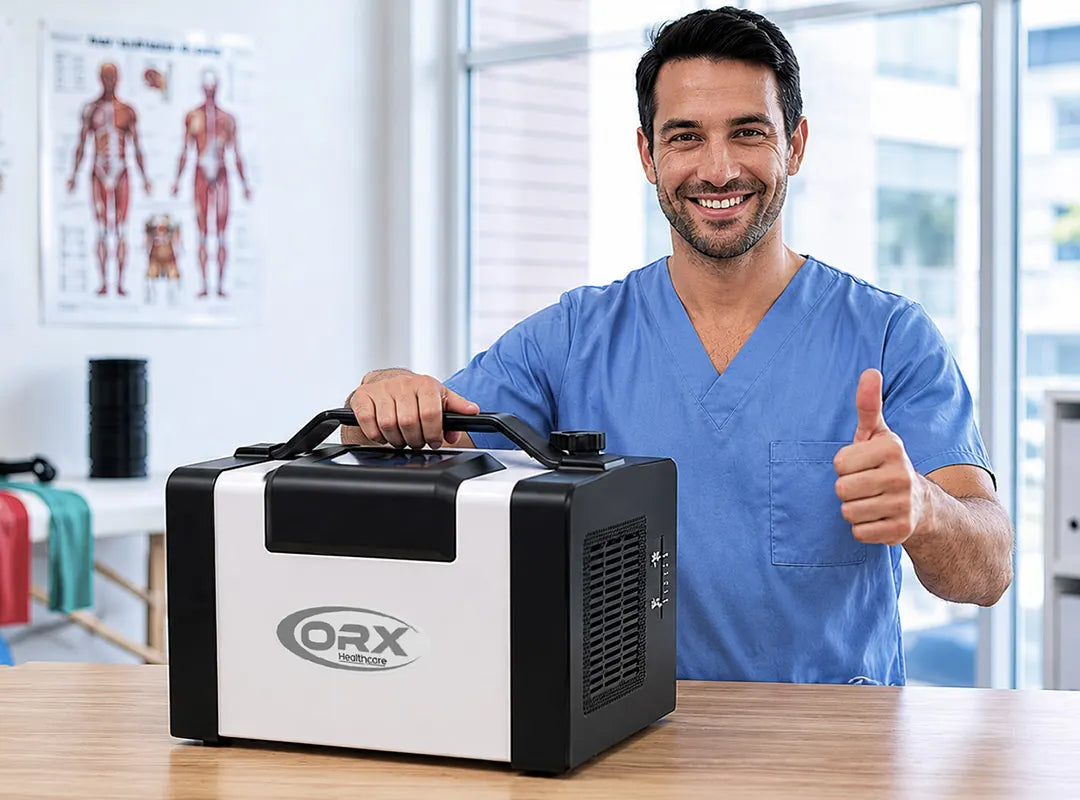 Man in blue scrubs with a ORX machine in a medical setting
